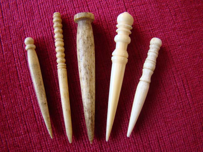 A group of five 19th century whale bone and whale ivory bodkins